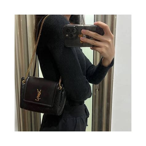 SAINT LAURENT Nolita mini leather shoulder bag .